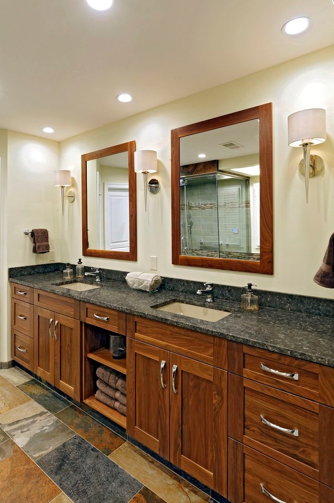 This is an example of a transitional bathroom in DC Metro with an undermount sink, flat-panel cabinets, medium wood cabinets, granite benchtops, an undermount tub, a bidet, multi-coloured tile and porcelain tile.