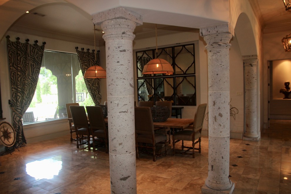 This is an example of a large mediterranean separate dining room in Houston with beige walls, porcelain floors and beige floor.