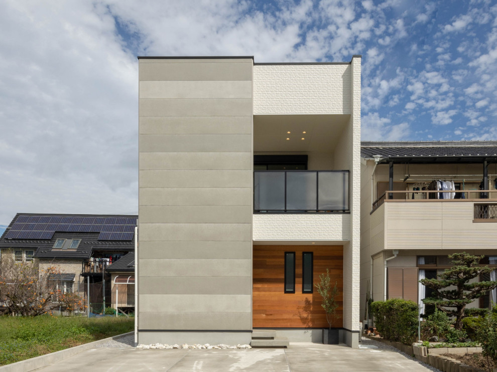 Mittelgroßes, Zweistöckiges Modernes Einfamilienhaus mit Mix-Fassade, Pultdach, Blechdach und grauem Dach in Sonstige