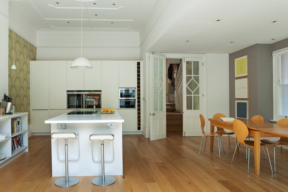 Design ideas for a contemporary kitchen/dining combo in London.