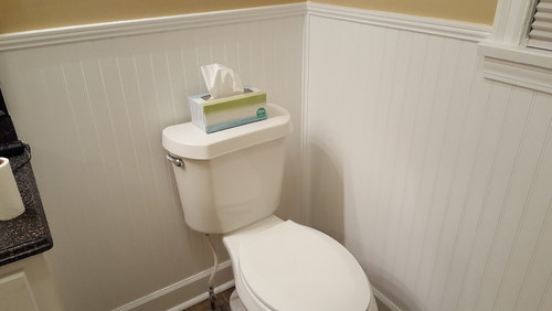 Where should I install my toilet paper holder?