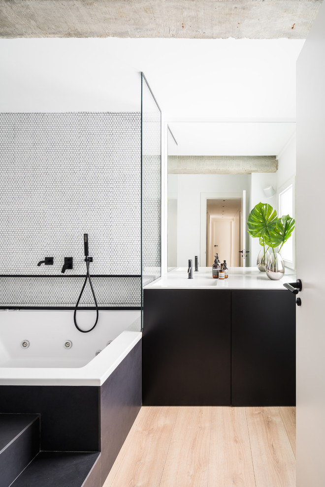 Photo of a contemporary master bathroom in Other with flat-panel cabinets, black cabinets, a hot tub, a shower/bathtub combo, white tile, mosaic tile, white walls, an integrated sink, beige floor, an open shower and white benchtops.
