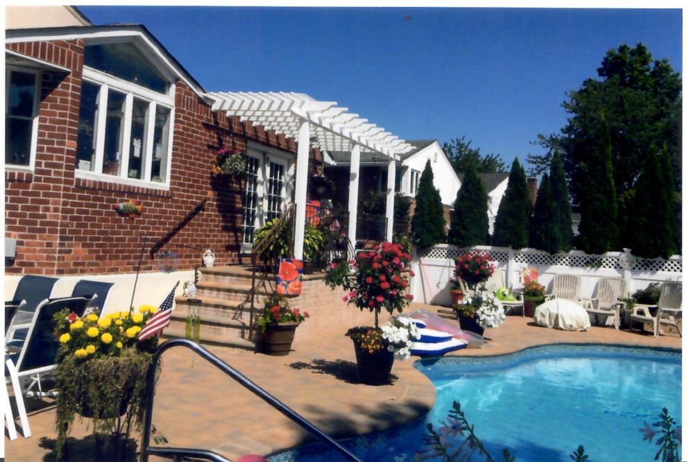 Pool with Whirl pool spill over, outdoor kitchen, outdoor bar, Pergola& Patio