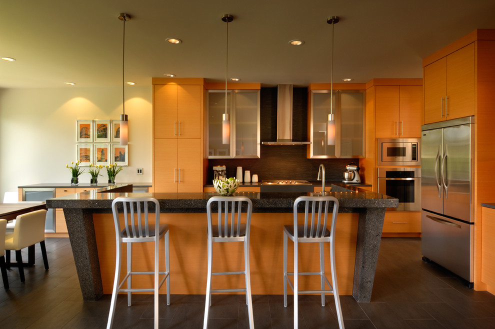 This is an example of a contemporary kitchen in Vancouver with concrete benchtops.