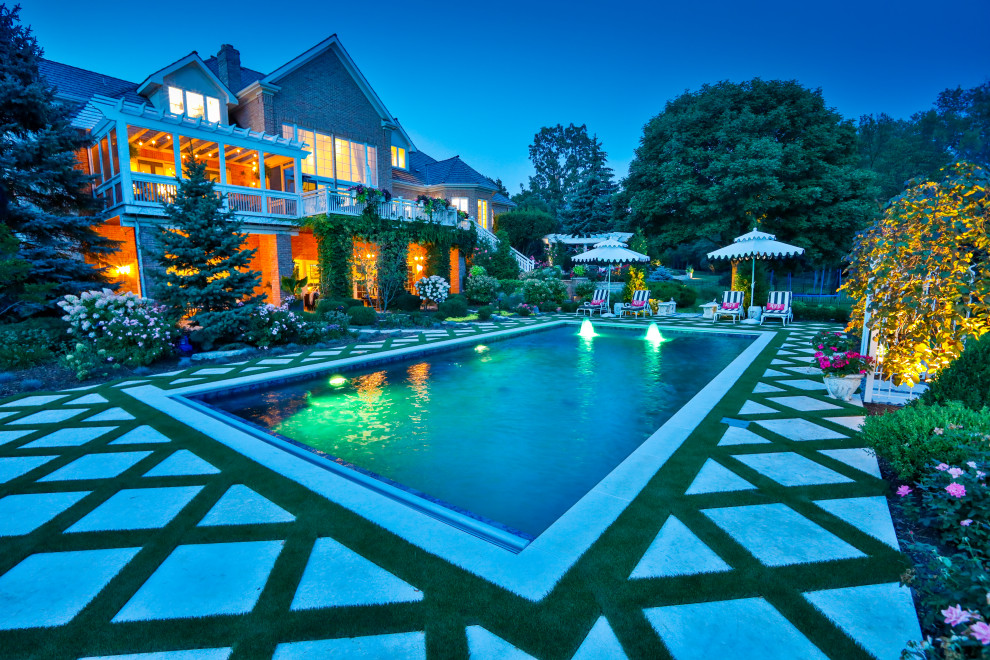 Idee per una piscina monocorsia classica rettangolare di medie dimensioni e dietro casa con paesaggistica bordo piscina e pavimentazioni in pietra naturale