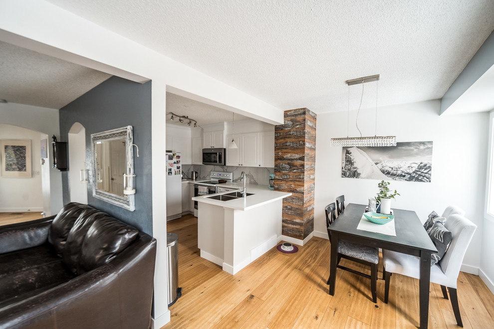 Example of a transitional kitchen design in Calgary