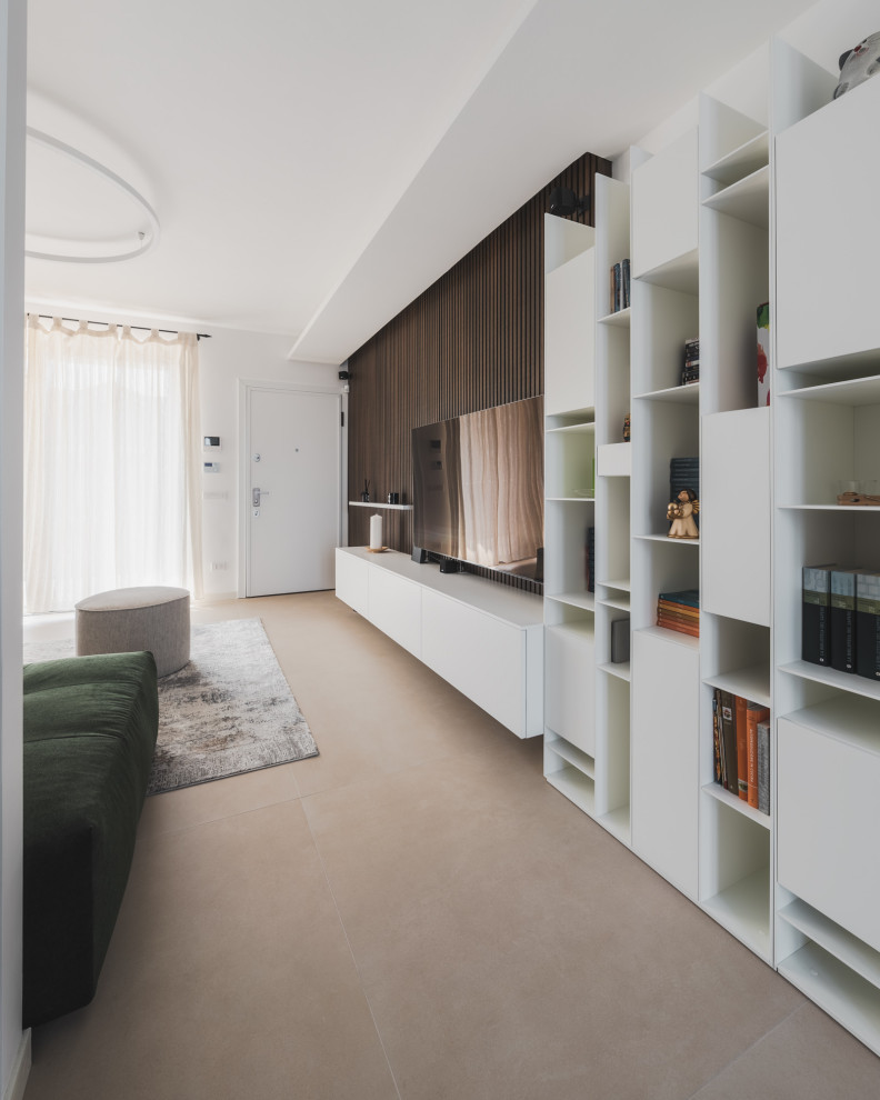 Inspiration for a large industrial open concept living room in Milan with a library, multi-coloured walls, porcelain floors, a built-in media wall, beige floor, recessed and wallpaper.