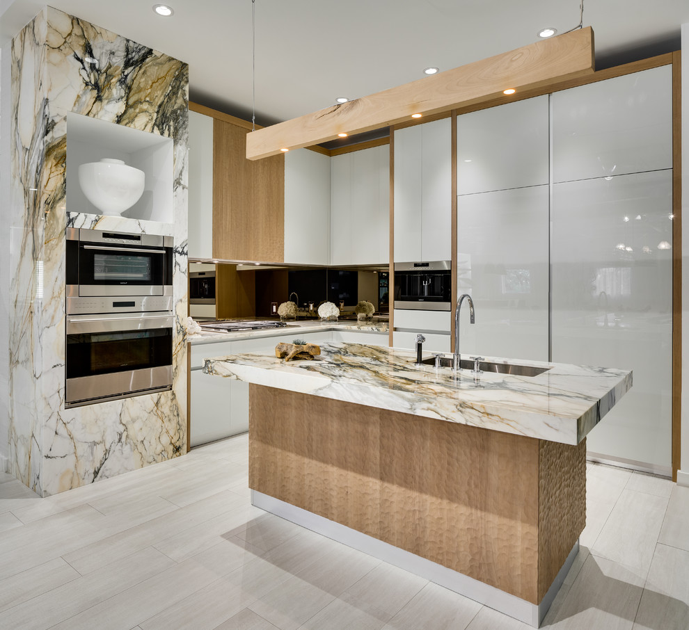 Inspiration for a large contemporary l-shaped kitchen in Miami with an undermount sink, flat-panel cabinets, white cabinets, mirror splashback, stainless steel appliances, porcelain floors, with island, white floor and multi-coloured benchtop.