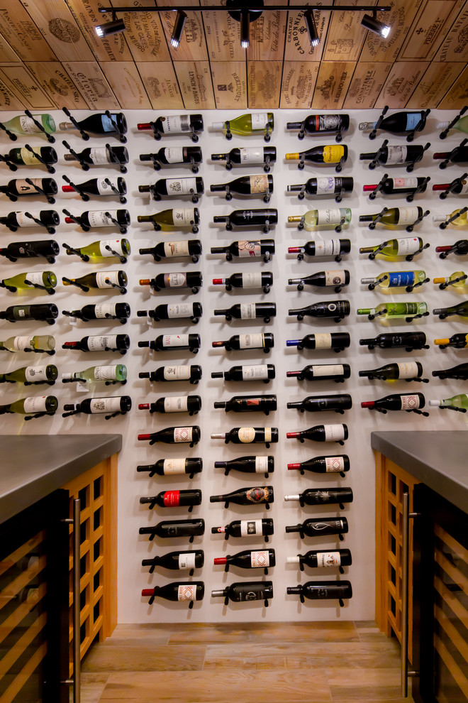 Inspiration for a mid-sized transitional wine cellar in Philadelphia with display racks and brown floor.