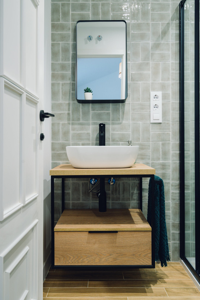Small urban 3/4 green tile and ceramic tile ceramic tile, brown floor and single-sink bathroom photo in Madrid with flat-panel cabinets, white cabinets, an urinal, green walls, a vessel sink, solid surface countertops, brown countertops and a built-in vanity