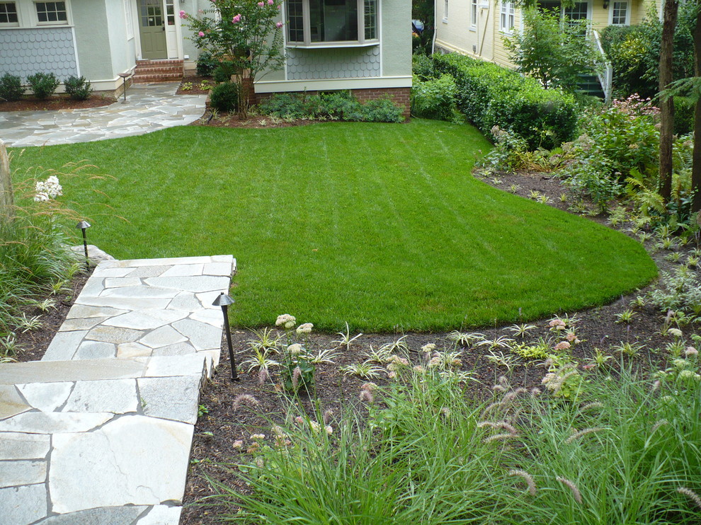 Inspiration for a mid-sized rustic backyard stone landscaping in Baltimore.