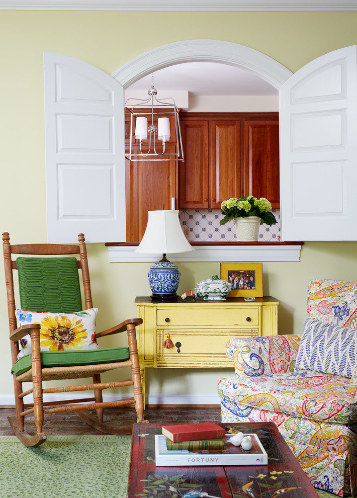 Inspiration for a country enclosed living room in DC Metro with no tv, yellow walls, brick floors and brown floor.