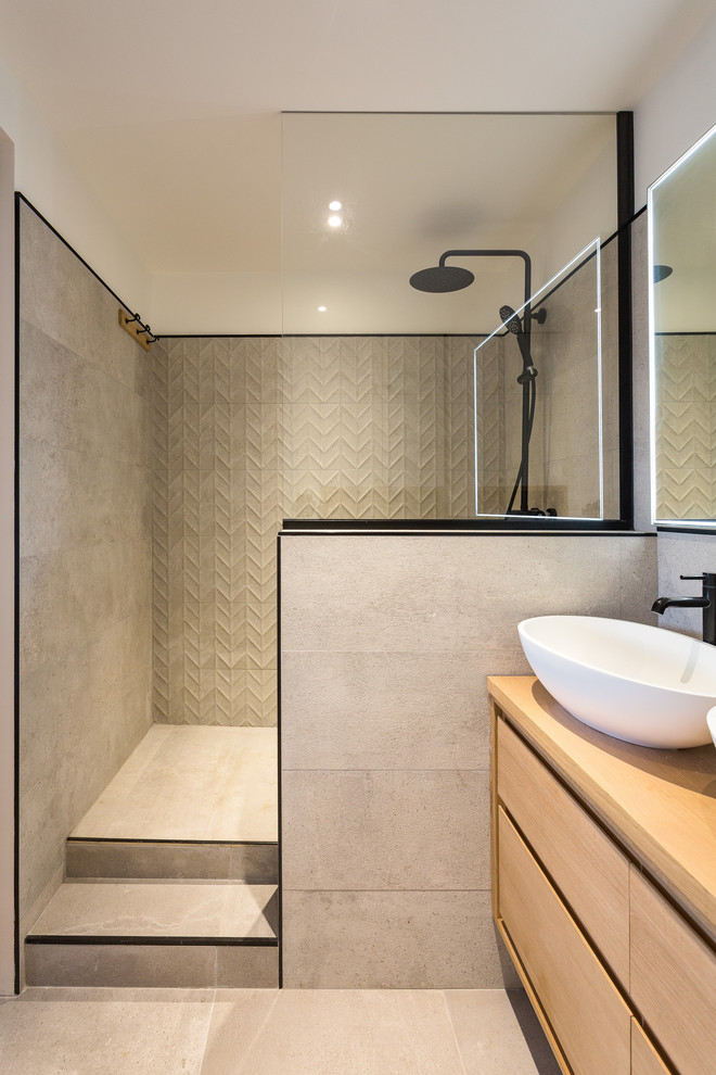 Inspiration for a mid-sized modern master bathroom in Other with flat-panel cabinets, beige cabinets, a curbless shower, beige tile, ceramic tile, white walls, ceramic floors, a vessel sink, wood benchtops, beige floor, an open shower and beige benchtops.