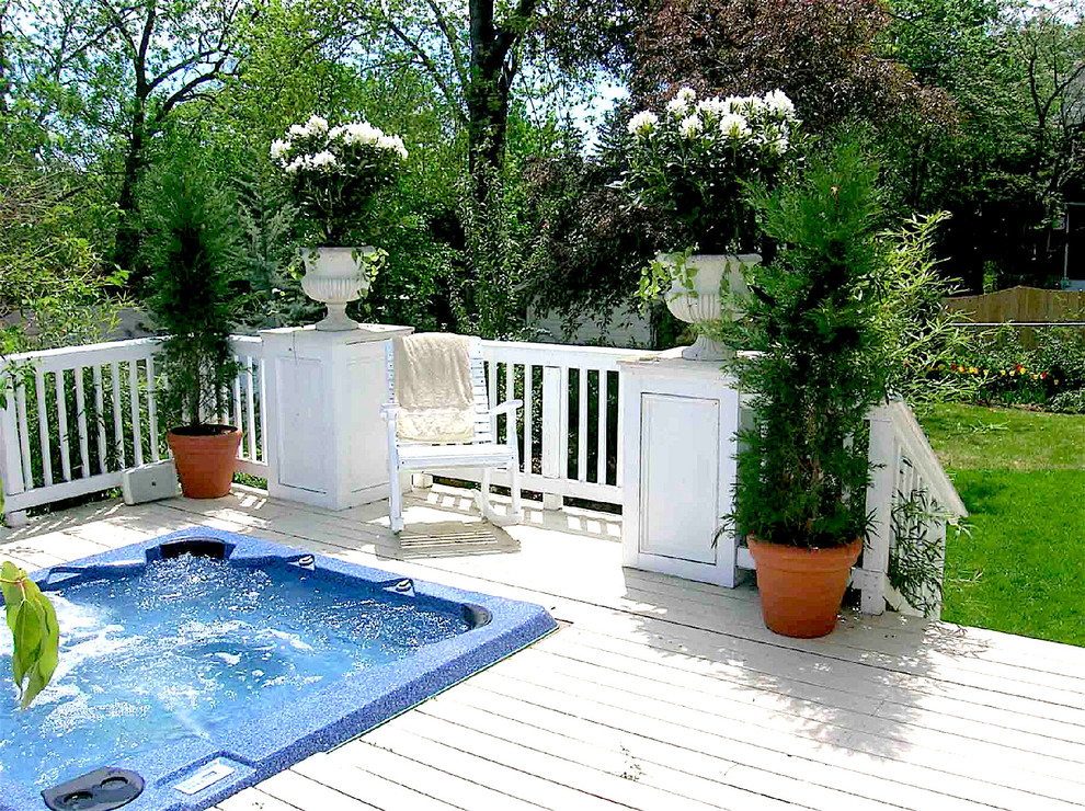 Photo of a mid-sized traditional backyard deck in Newark with a water feature.
