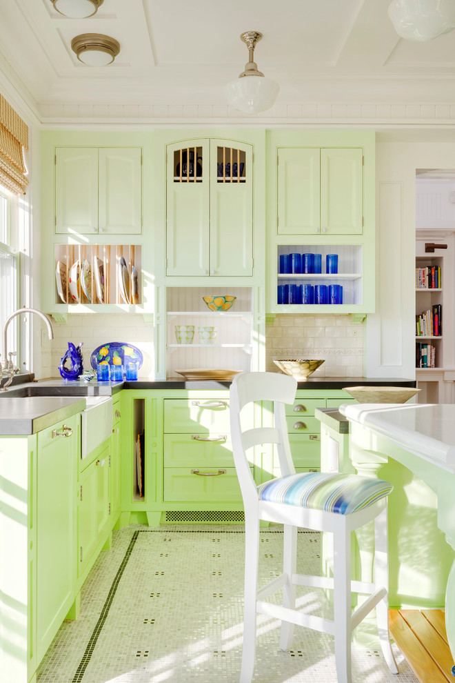 Inspiration for a large coastal u-shaped ceramic tile and multicolored floor enclosed kitchen remodel in Boston with a farmhouse sink, recessed-panel cabinets, green cabinets, solid surface countertops, white backsplash, subway tile backsplash and an island