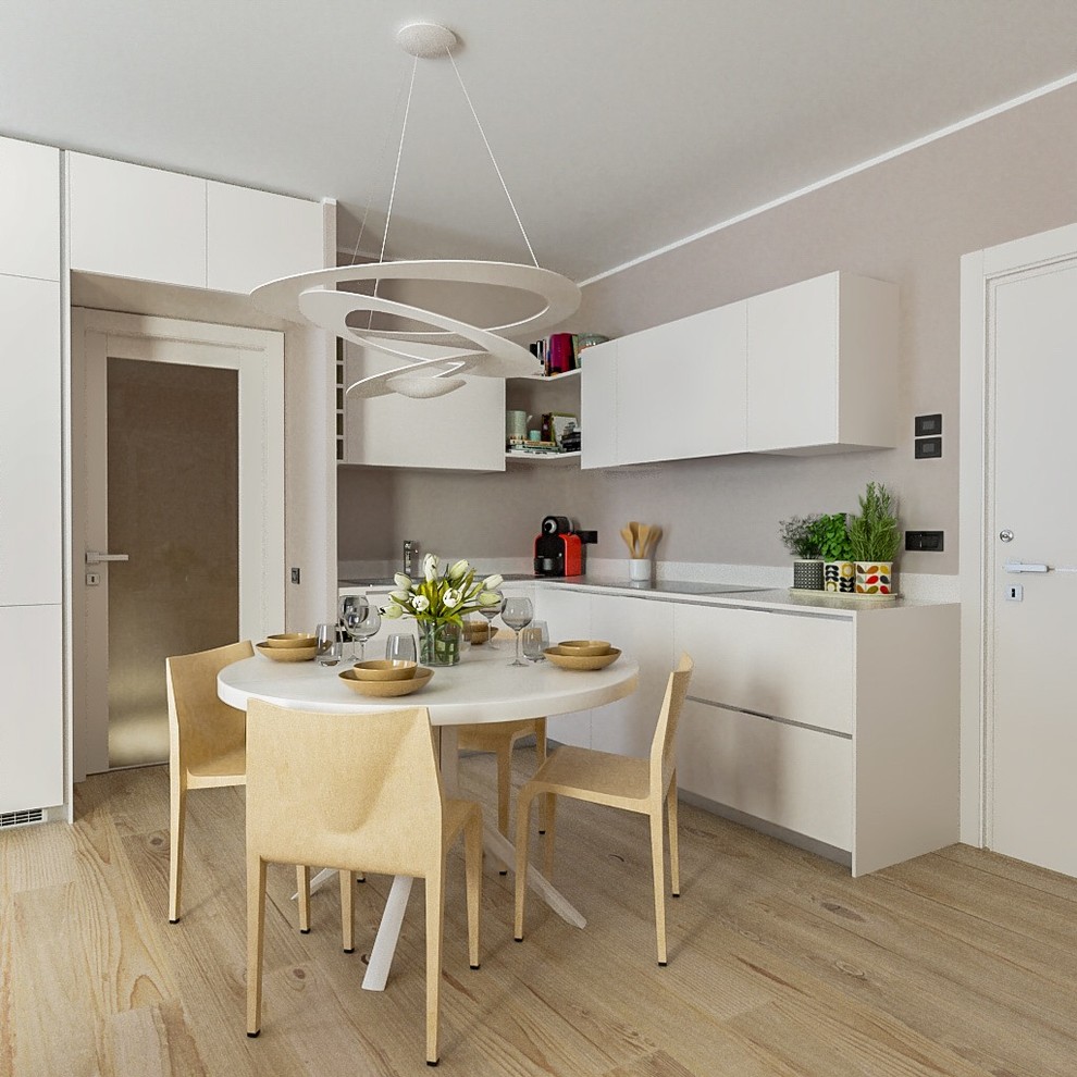 Inspiration for a mid-sized contemporary l-shaped eat-in kitchen with flat-panel cabinets, white cabinets, solid surface benchtops, stainless steel appliances, light hardwood floors, no island, white benchtop and beige floor.