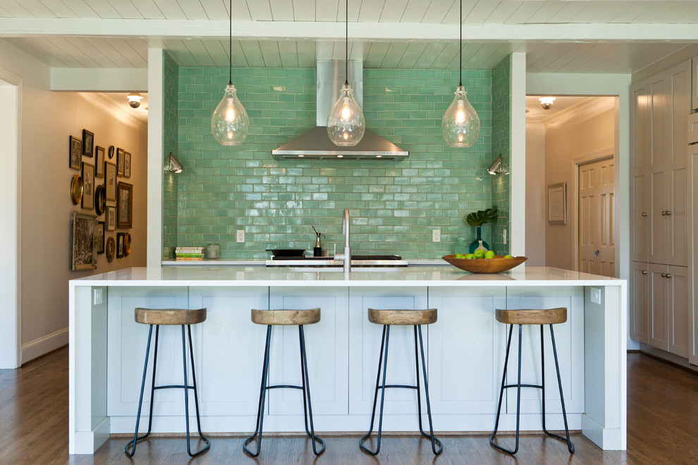 Eat-in kitchen - transitional single-wall eat-in kitchen idea in Charlotte with white cabinets, green backsplash, stainless steel appliances, an island and subway tile backsplash