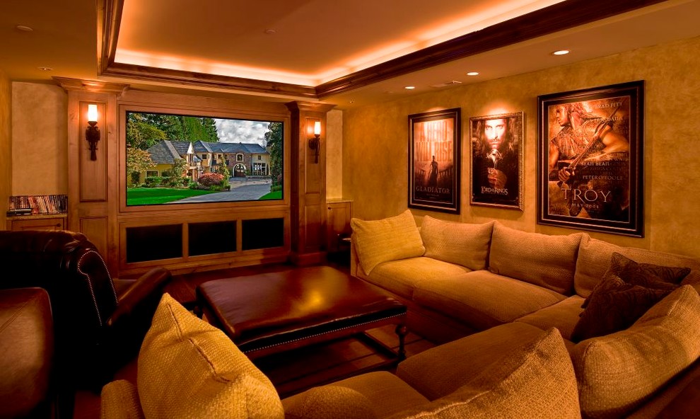 Inspiration for a large mediterranean enclosed home theatre in Seattle with a built-in media wall, beige walls and carpet.