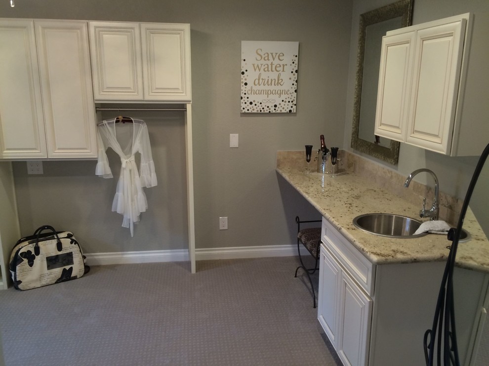 Mid-sized traditional women's dressing room in San Diego with beaded inset cabinets, white cabinets and carpet.