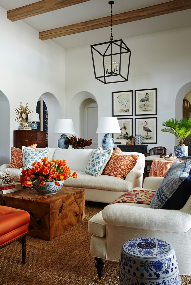 Example of a huge classic open concept carpeted living room design in Miami with white walls and no tv