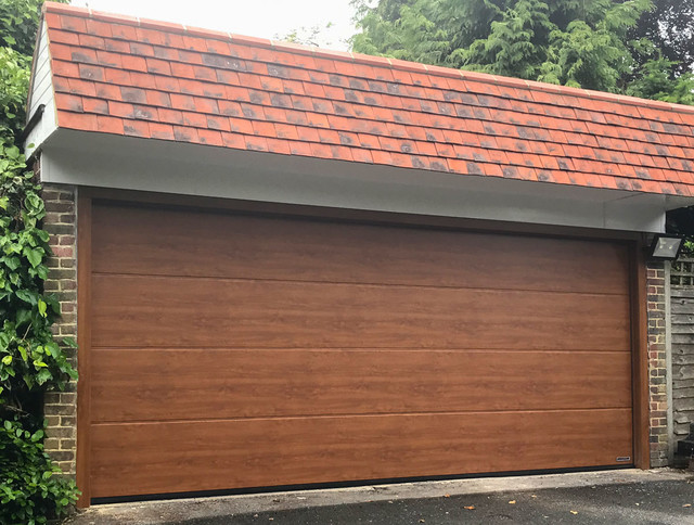 Hormann Lpu42 L Ribbed Steel Sectional Garage Door In Golden Oak