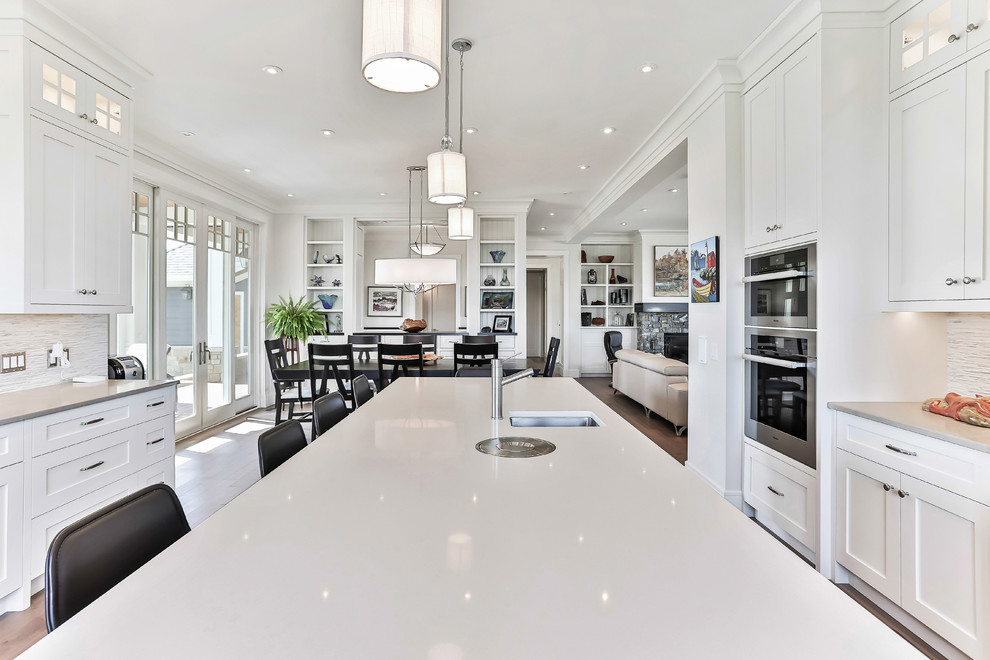 Example of a transitional kitchen design in Calgary