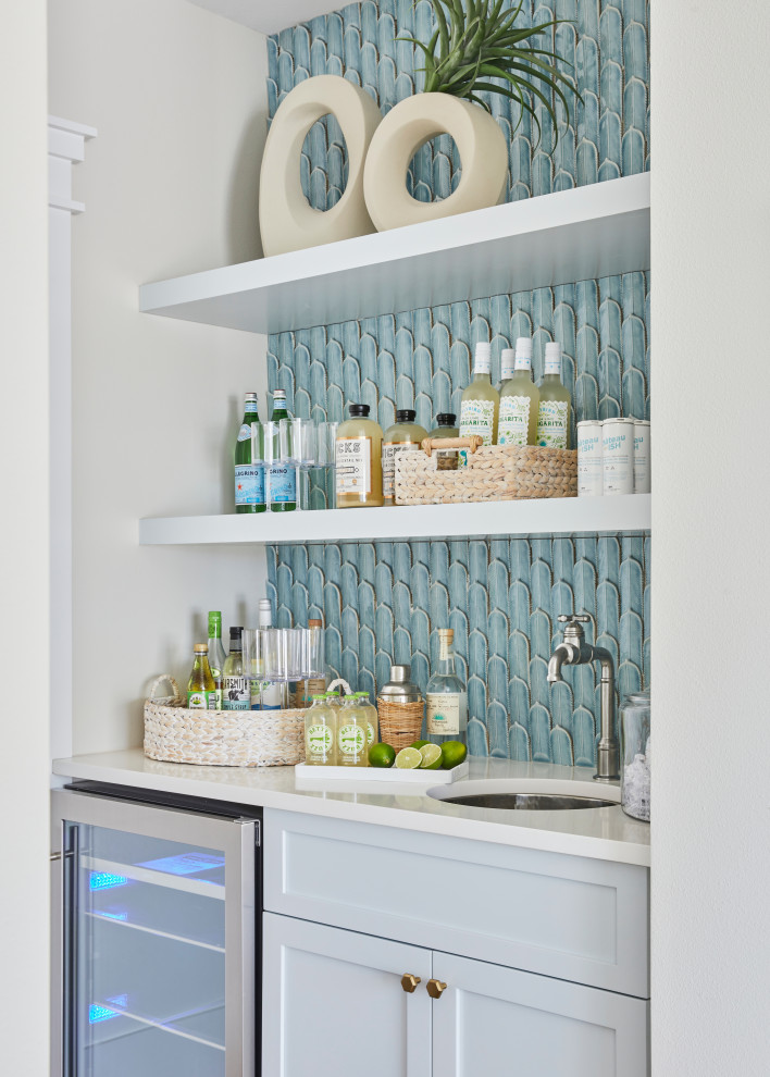 This is an example of a beach style home bar.