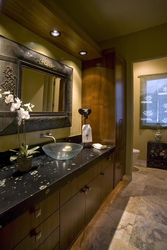 This is an example of a country bathroom in Orange County with a vessel sink.