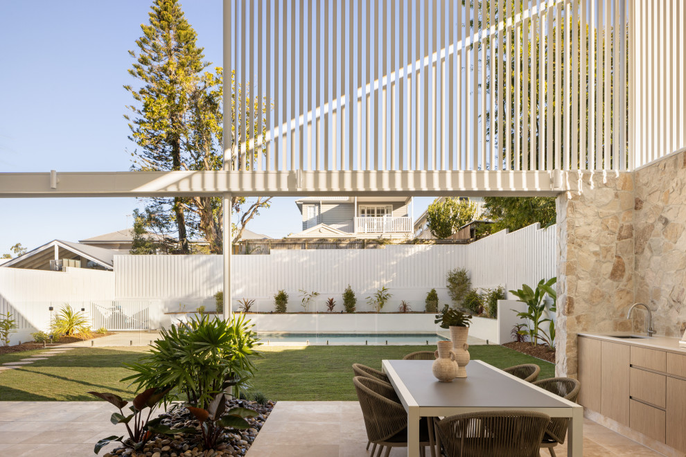 Design ideas for a beach style patio in Brisbane.