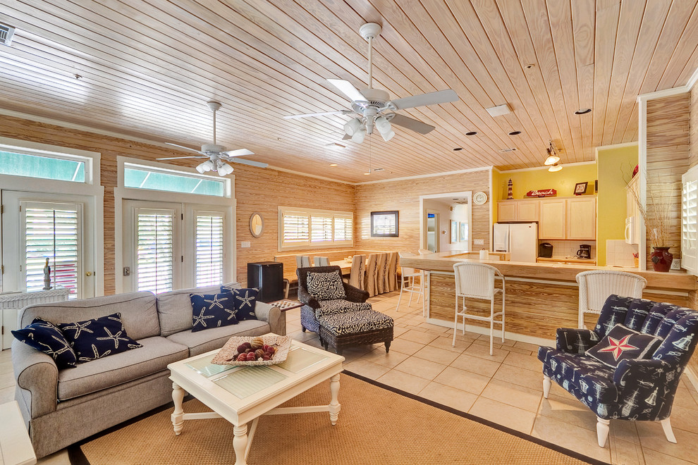 Design ideas for a beach style open concept living room in Miami.
