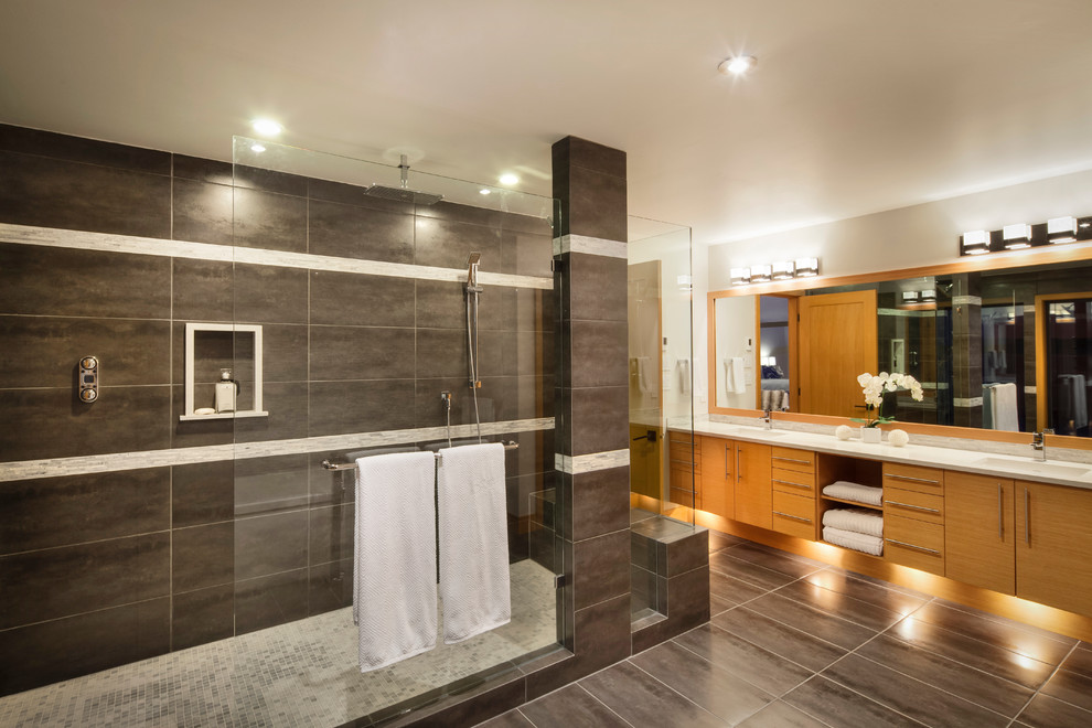 This is an example of a large contemporary master bathroom in Vancouver with an open shower, flat-panel cabinets, white walls, ceramic floors, granite benchtops, medium wood cabinets and an open shower.