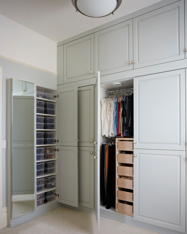 Design ideas for a mid-sized traditional storage and wardrobe in San Francisco with marble floors and green floor.