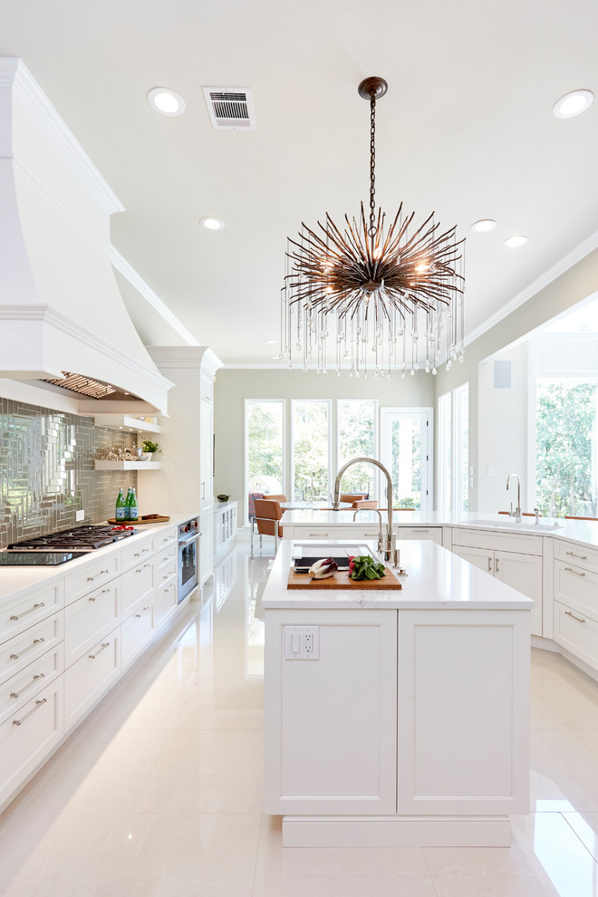 Photo of a transitional u-shaped kitchen in Dallas with recessed-panel cabinets, white cabinets, with island, white floor and white benchtop.