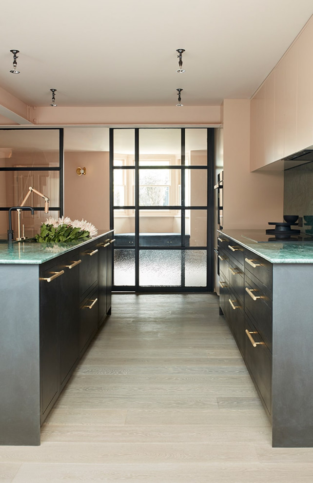 Large victorian galley kitchen/diner in London with a submerged sink, flat-panel cabinets, pink cabinets, marble worktops, green splashback, marble splashback, light hardwood flooring, an island, beige floors, green worktops and exposed beams.