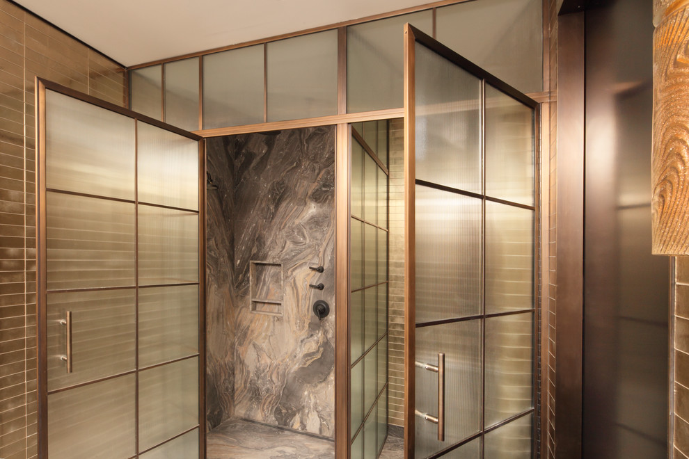 Expansive contemporary master bathroom in New York with an alcove shower, brown tile and brown walls.