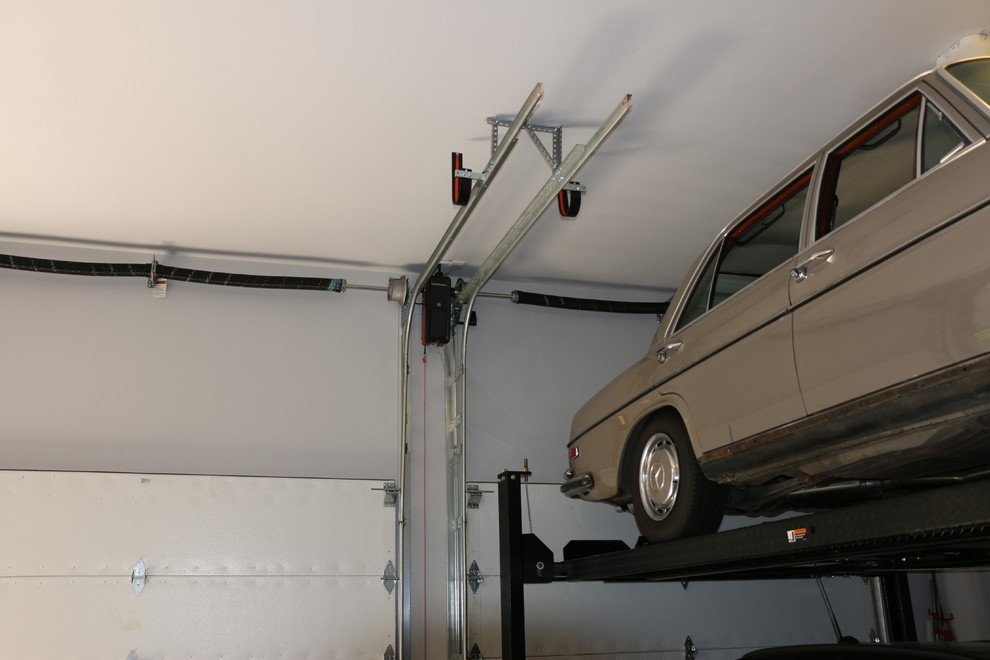 Photo of a large attached three-car garage in Austin.