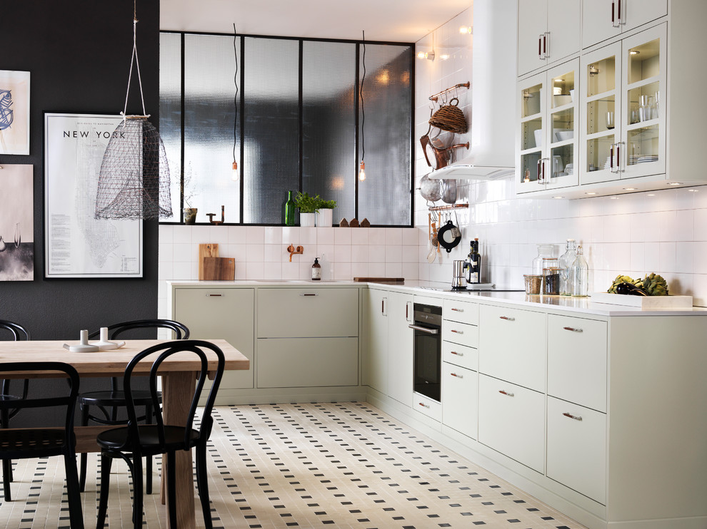 Large industrial l-shaped eat-in kitchen in Malmo with a double-bowl sink, flat-panel cabinets, granite benchtops, ceramic floors, no island and beige cabinets.