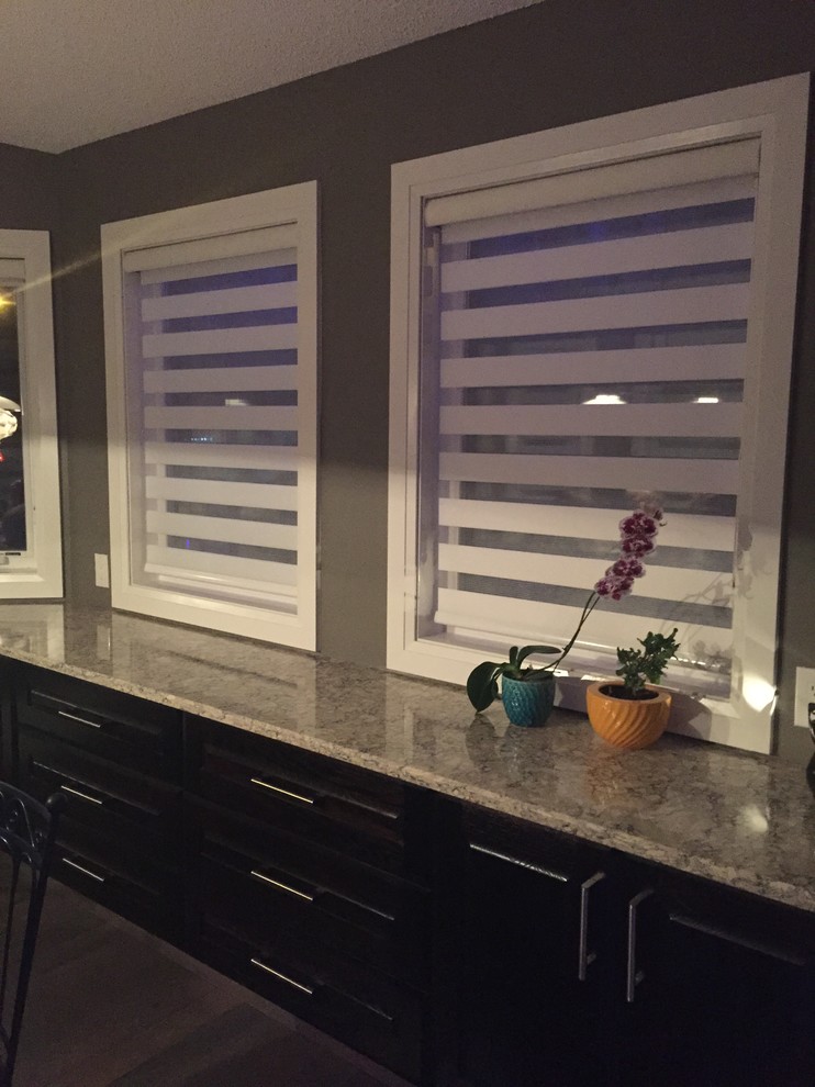 Example of a transitional kitchen design in Calgary