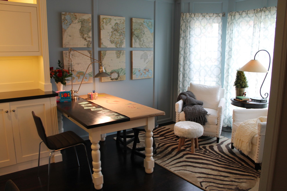 Large contemporary study room in San Luis Obispo with blue walls, dark hardwood floors and a freestanding desk.