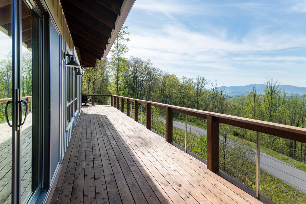 Mid-sized transitional backyard deck photo with no cover