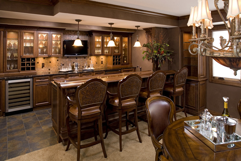 This is an example of a traditional kitchen in Minneapolis with glass-front cabinets and dark wood cabinets.