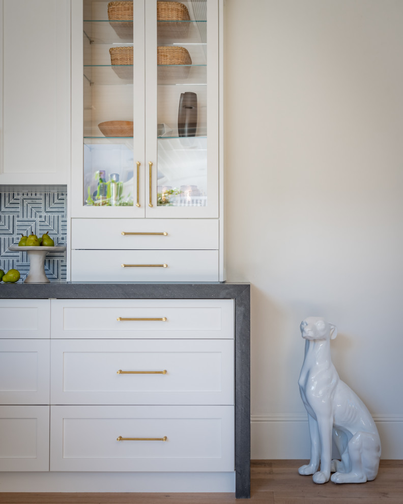 Inspiration for a huge transitional light wood floor kitchen remodel in Orange County with an undermount sink, quartzite countertops, mosaic tile backsplash and an island