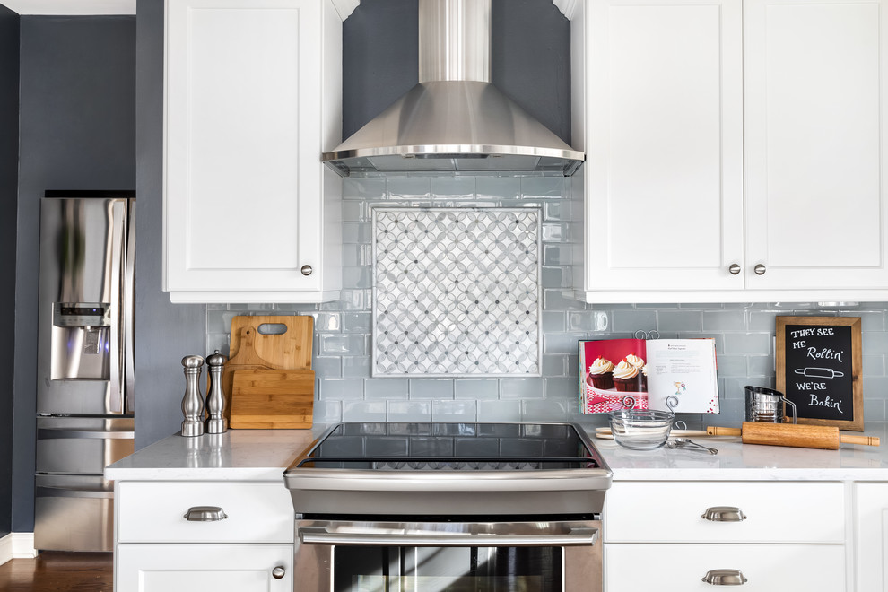 Huge transitional l-shaped dark wood floor and brown floor eat-in kitchen photo in Philadelphia with a single-bowl sink, flat-panel cabinets, white cabinets, quartzite countertops, gray backsplash, ceramic backsplash, stainless steel appliances, an island and white countertops