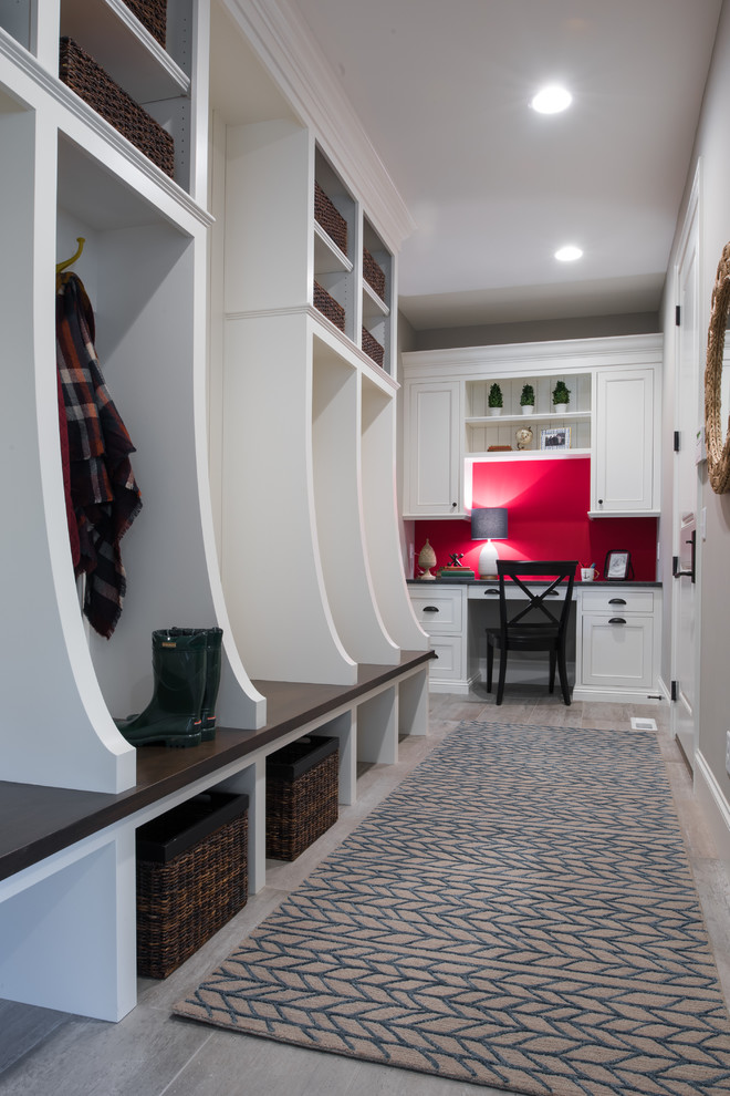 This is an example of a mid-sized transitional hallway in Minneapolis with grey walls, medium hardwood floors and grey floor.