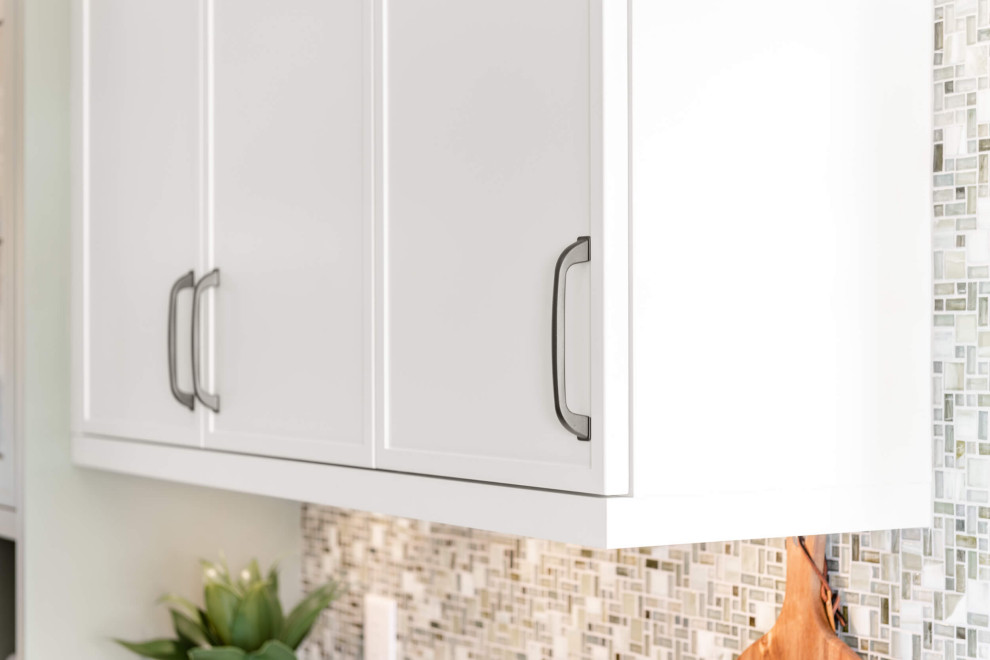 Mid-sized transitional galley eat-in kitchen photo with shaker cabinets and an island