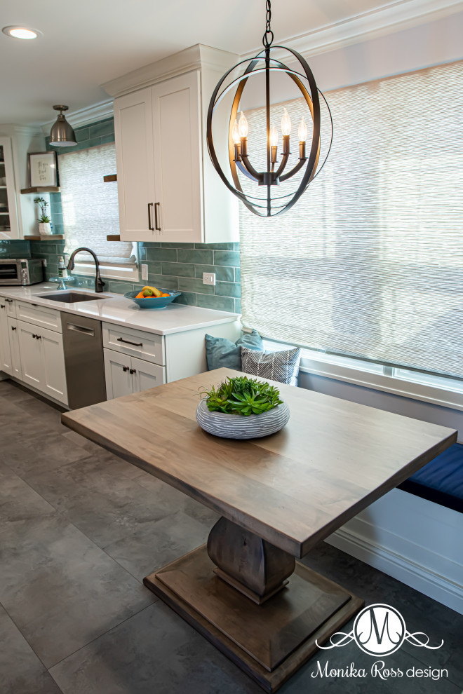 Eat-in kitchen - large coastal u-shaped vinyl floor and gray floor eat-in kitchen idea in Chicago with an undermount sink, shaker cabinets, white cabinets, quartz countertops, blue backsplash, ceramic backsplash, stainless steel appliances, an island and white countertops