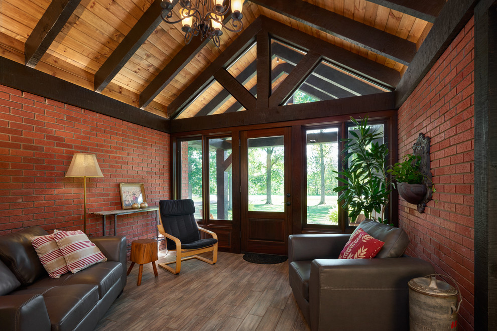 Mid-sized mountain style porcelain tile foyer photo in Toronto with red walls and a dark wood front door