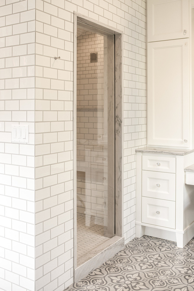 Mid-sized contemporary master bathroom in Other with recessed-panel cabinets, white cabinets, an open shower, beige tile, cement tile, white walls, concrete floors and quartzite benchtops.