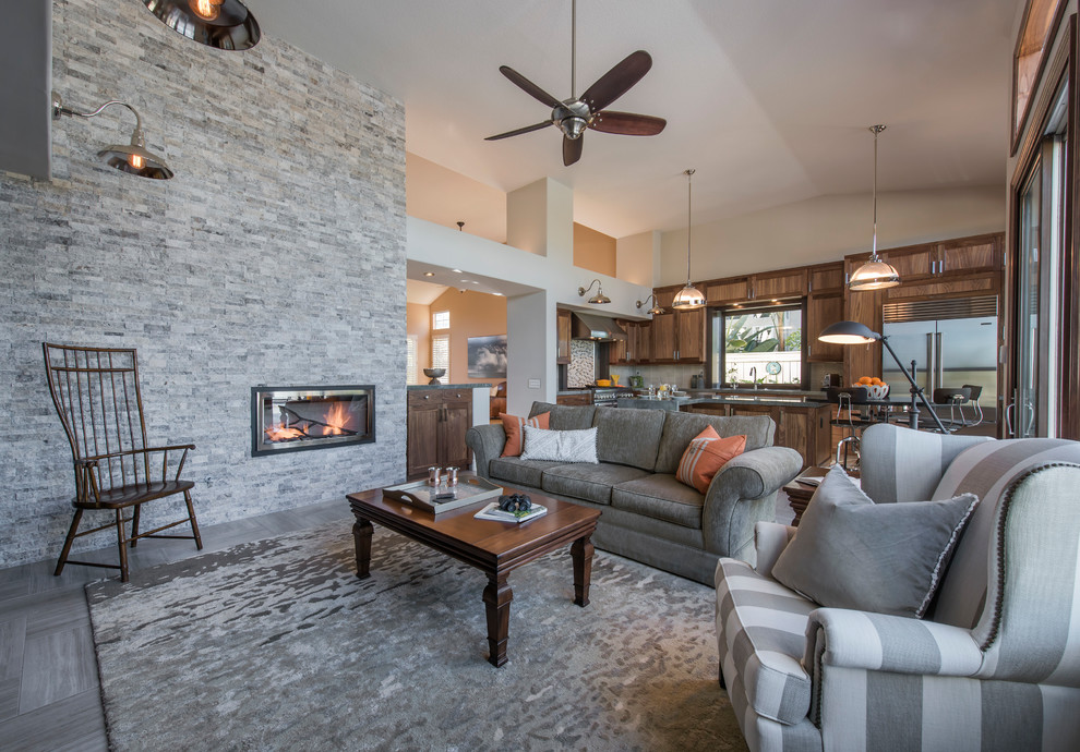 Example of a large transitional l-shaped ceramic tile and gray floor open concept kitchen design with an undermount sink, recessed-panel cabinets, dark wood cabinets, granite countertops, multicolored backsplash, mosaic tile backsplash, stainless steel appliances and an island