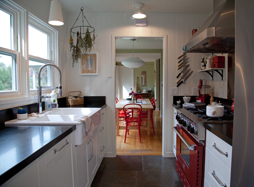 This is an example of a country galley separate kitchen in San Francisco with a drop-in sink, coloured appliances, white cabinets, recessed-panel cabinets and no island.